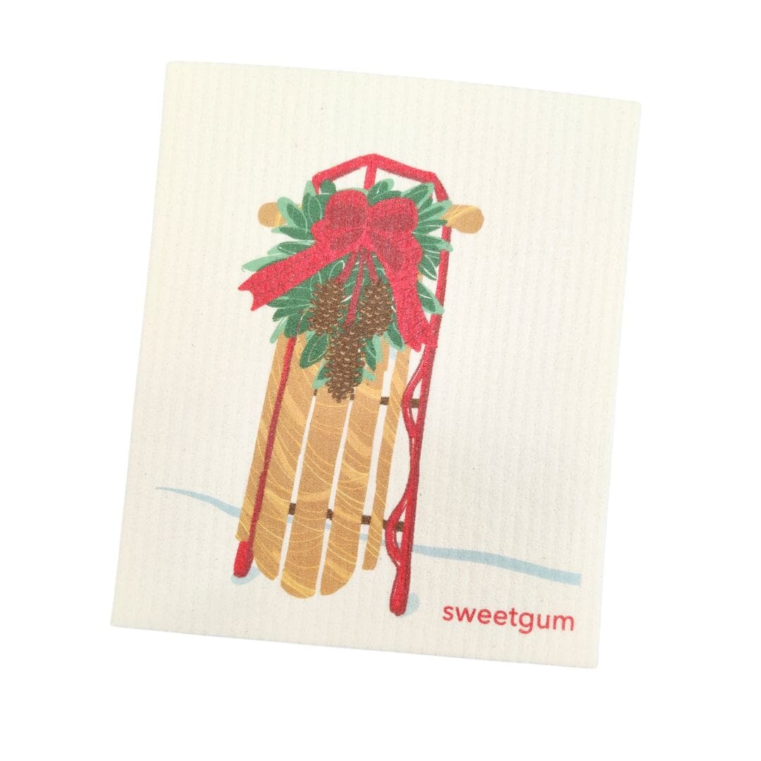 Sled with Red Bow &amp; Pinecone Swag Swedish Dishcloth | Christmas &amp; Winter Swedish Dishcloths sweetgum textiles company, LLC 